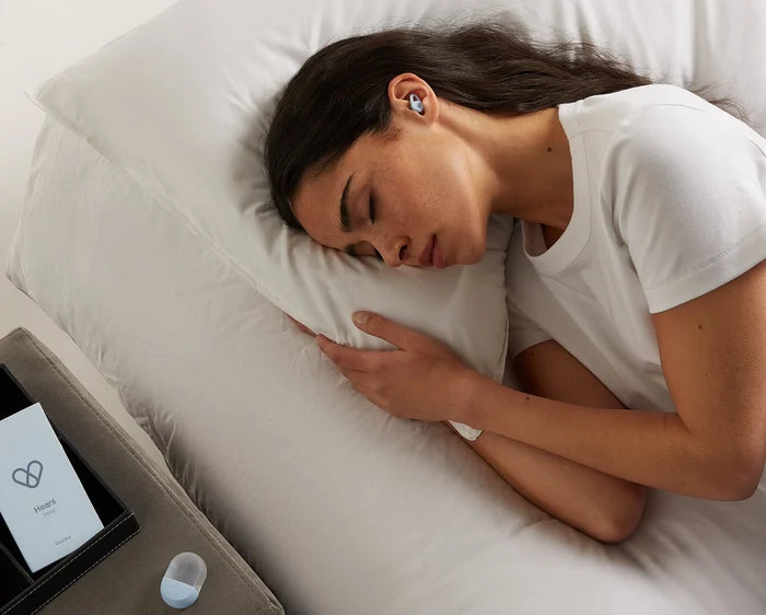 woman sleeping with Hears ear plugs