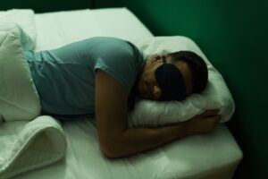 person using an eye mask for a dark bedroom